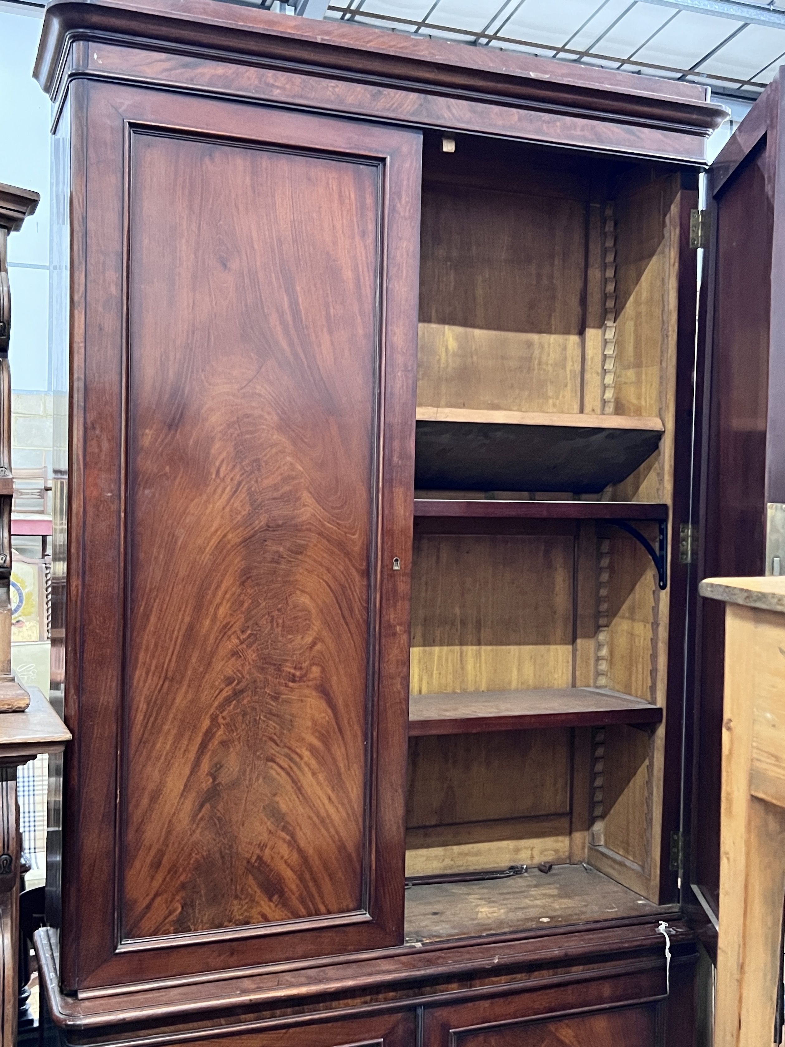 A Victorian mahogany library bookcase cupboard, width 110cm, depth 39cm, height 222cm